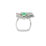 Platinum emerald and diamond ring featuring a 2.93ct emerald-cut centre stone with pavé diamond open book–style surround.