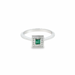 18ct white gold ring featuring a 0.17ct square emerald in a rubbed-in setting surrounded by princess cut diamonds totalling 0.22ct.
