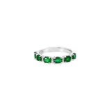 18ct white gold ring featuring alternating claw-set oval-cut emeralds and round brilliant cut diamonds in a horizontal design across the top.