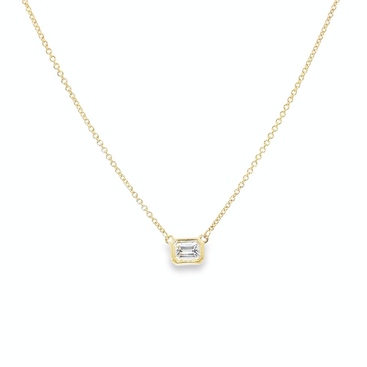 18ct yellow gold necklace with emerald cut diamond set horizontally in bezel