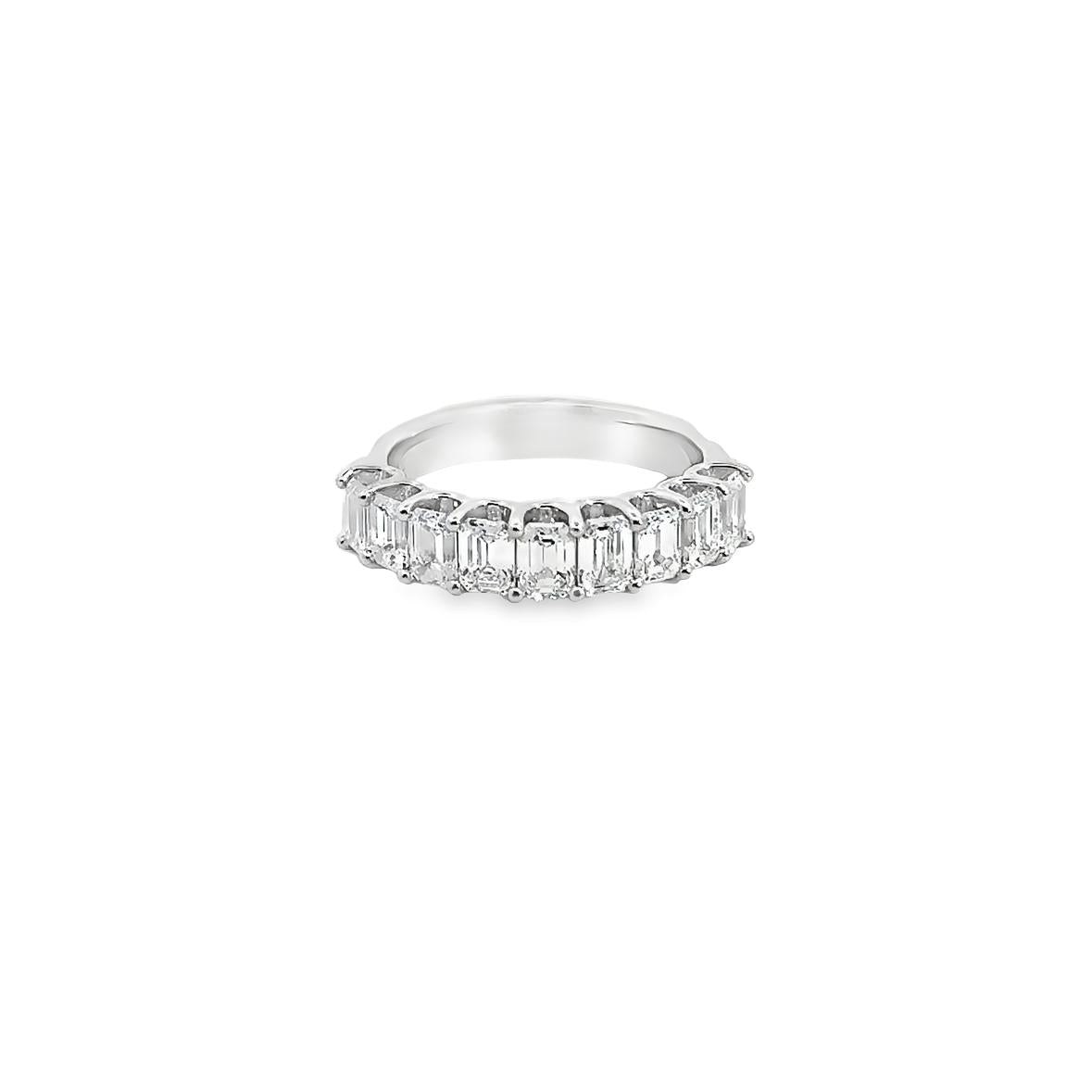 18ct white gold ring featuring nine emerald cut diamonds totalling 2.15ct in a straight row claw setting with a scalloped undercarriage.