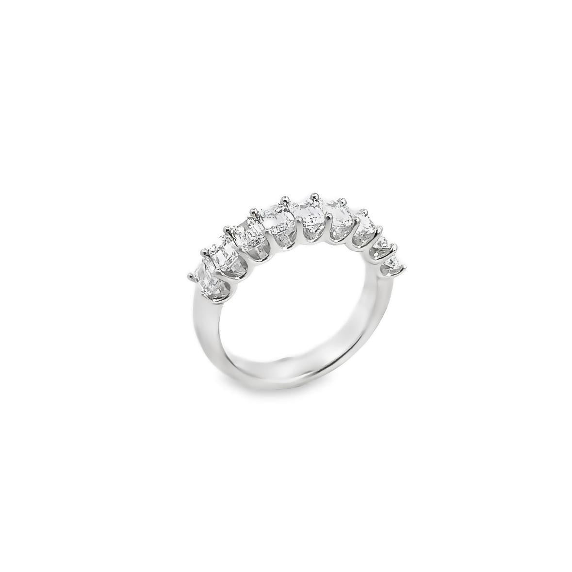 18ct white gold ring featuring nine emerald cut diamonds totalling 2.15ct in a straight row claw setting with a scalloped undercarriage.