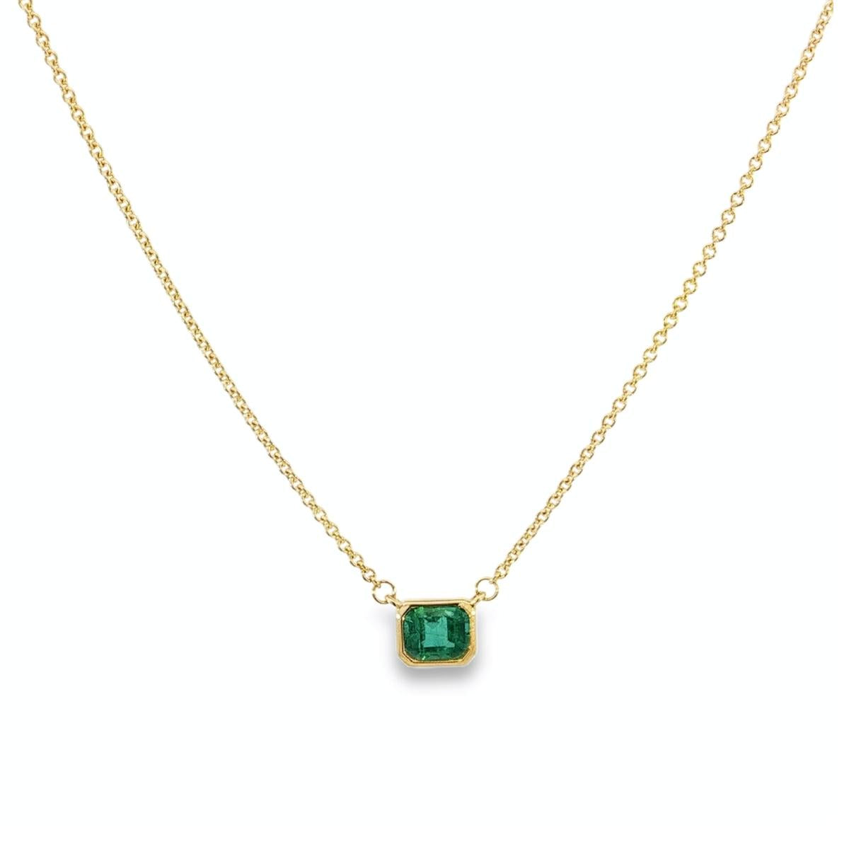 18ct yellow gold necklace with emerald cut emerald set horizontally in bezel