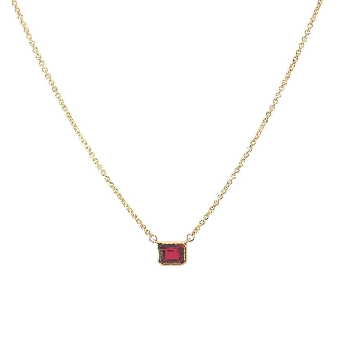 18ct yellow gold necklace with emerald cut ruby set horizontally in bezel