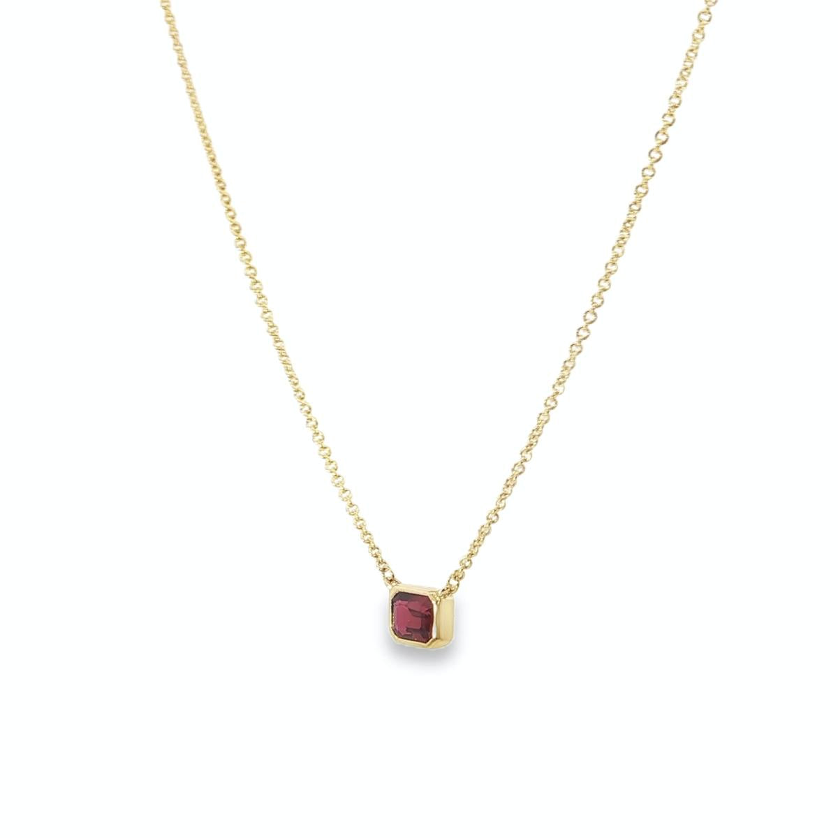 18ct yellow gold necklace with emerald cut ruby set horizontally in bezel
