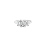 Platinum three-stone diamond ring featuring three emerald-cut diamonds in a tiered setting with post and double-bearing undercarriage, centre 2.00ct G/SI1, side stones 0.86ct F/VVS2 and 0.84ct F/VS1.