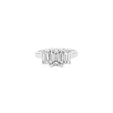 Platinum three-stone diamond ring featuring three emerald-cut diamonds in a tiered setting with post and double-bearing undercarriage, centre 2.00ct G/SI1, side stones 0.86ct F/VVS2 and 0.84ct F/VS1.