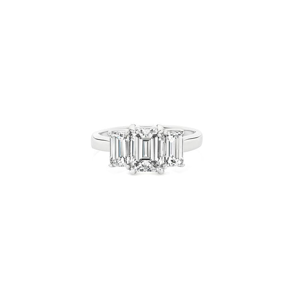 Platinum three-stone diamond ring featuring three emerald-cut diamonds in a tiered setting with post and double-bearing undercarriage, centre 2.00ct G/SI1, side stones 0.86ct F/VVS2 and 0.84ct F/VS1.