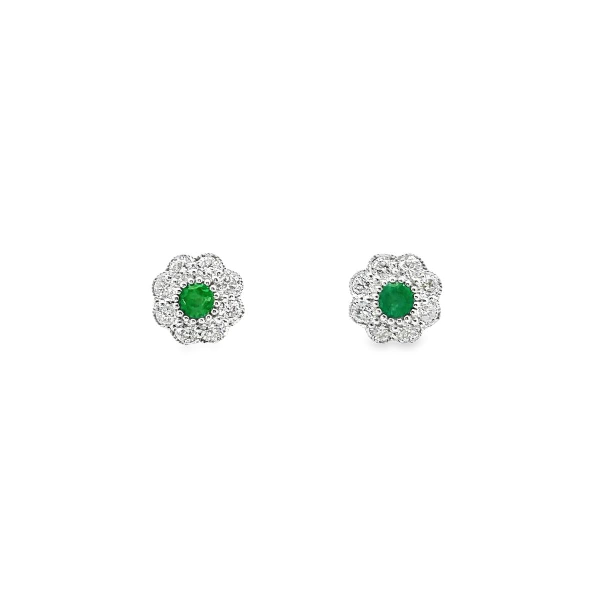 9ct white gold stud earrings featuring bezel-set emerald centres surrounded by a posy-style cluster of round brilliant cut diamonds, post and butterfly fittings.