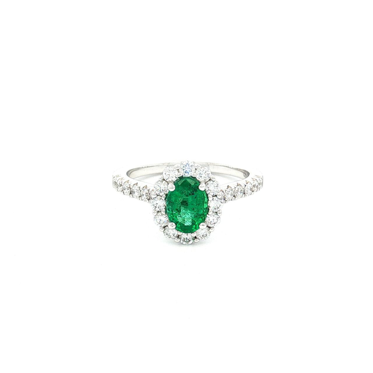 18ct white gold emerald and diamond ring with oval emerald and halo design