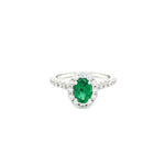 18ct white gold emerald and diamond ring with oval emerald and halo design