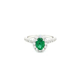 18ct white gold emerald and diamond ring with oval emerald and halo design