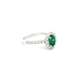 18ct white gold emerald and diamond ring with oval emerald and halo design