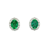 18ct white gold emerald and diamond stud earrings with oval emeralds and halo design