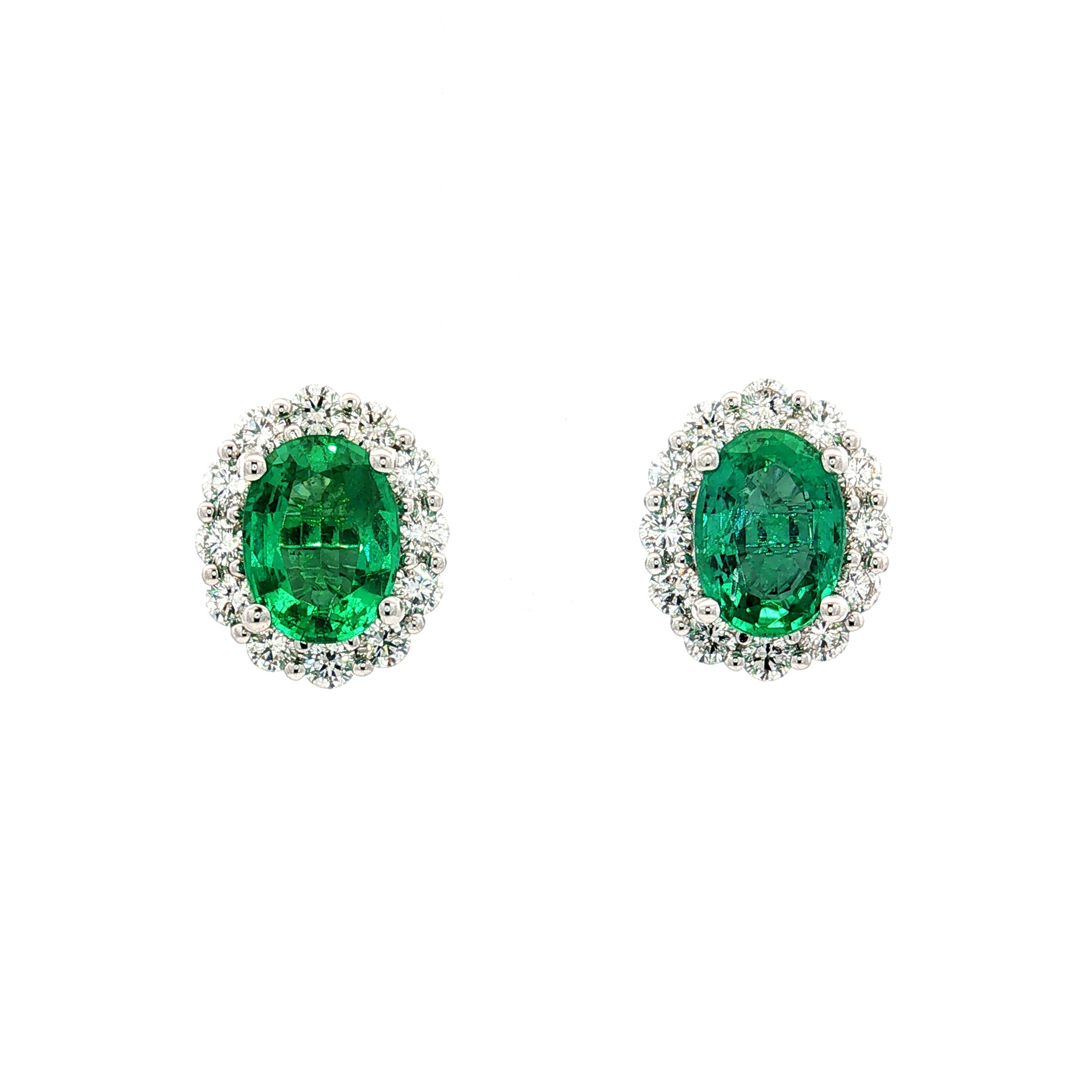 18ct white gold emerald and diamond stud earrings with oval emeralds and halo design