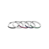 18ct white gold huggie earrings featuring claw-set emeralds along the front and back, medium size with 11mm inside diameter and hinged fittings.