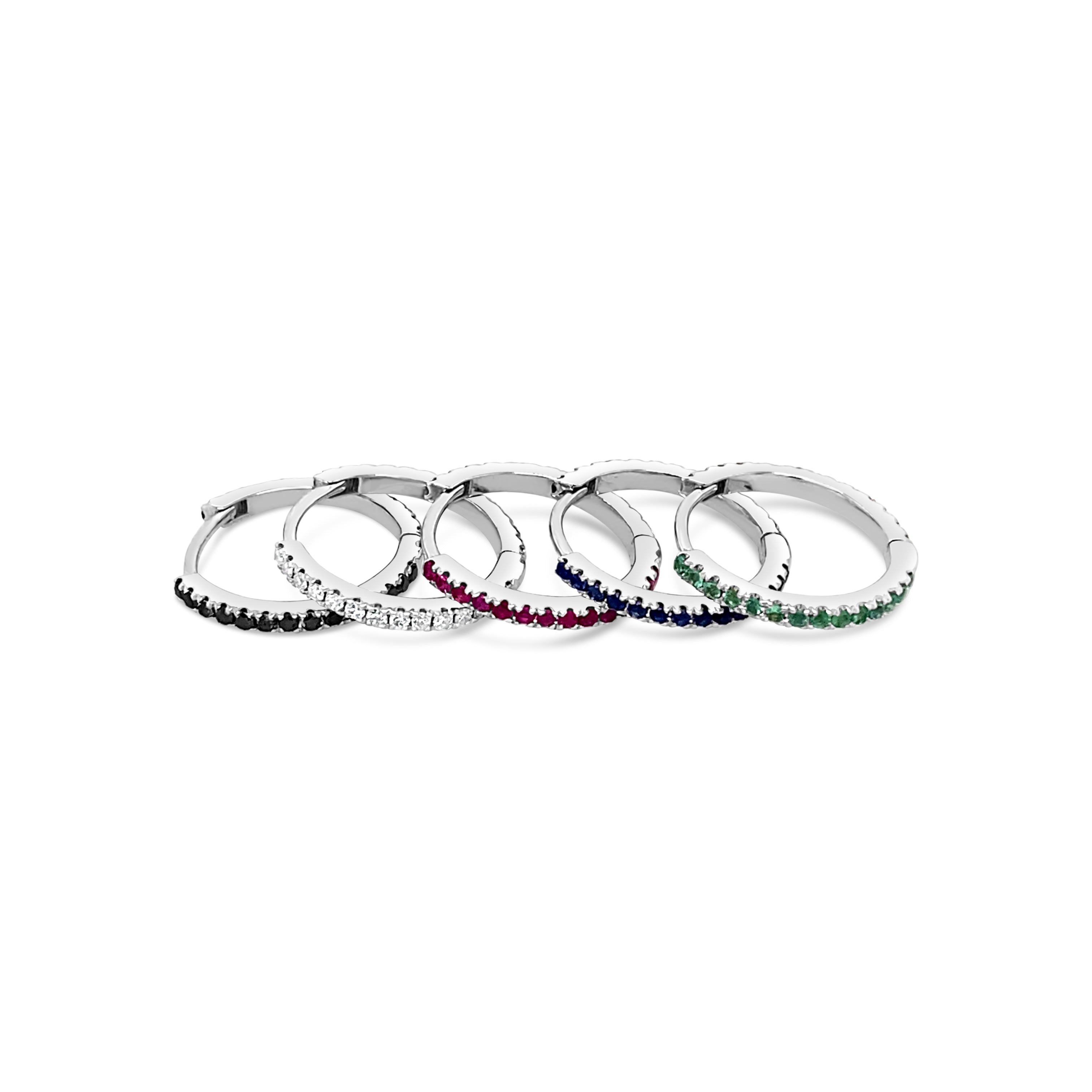 18ct white gold huggie earrings featuring claw-set emeralds along the front and back, medium size with 11mm inside diameter and hinged fittings.