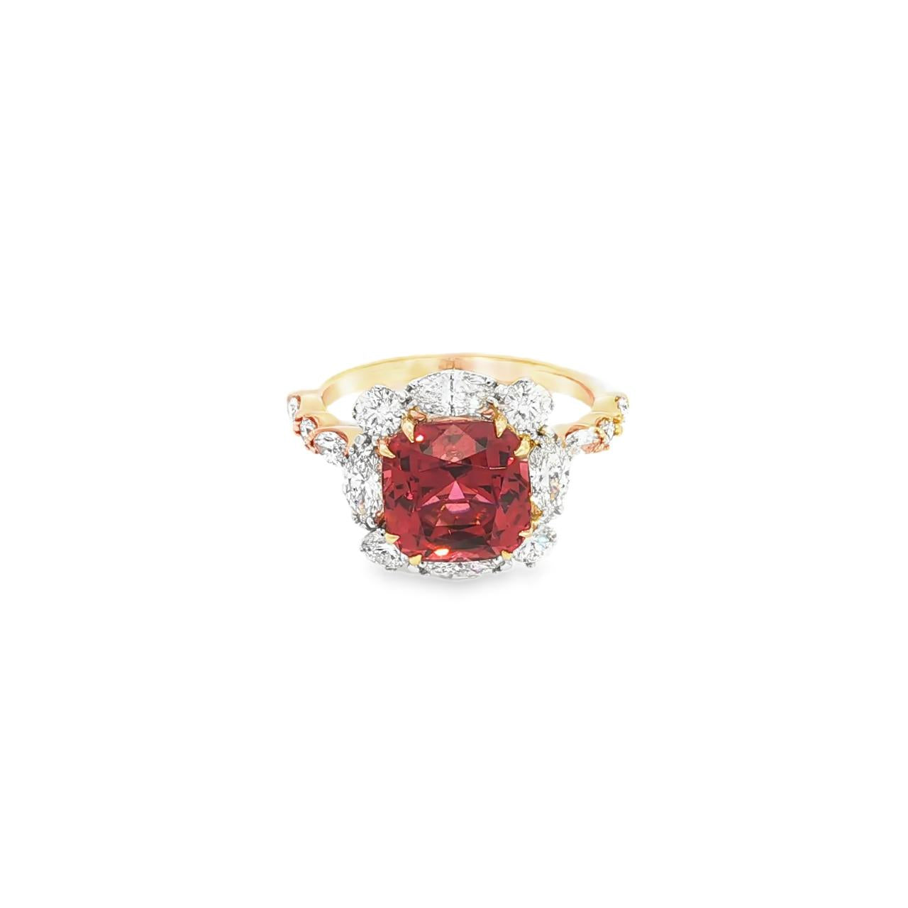 18ct rose gold ring featuring a 4.55ct cushion Malaya garnet with alternating marquise and round diamond clusters surrounding the centre stone and along the shoulders.