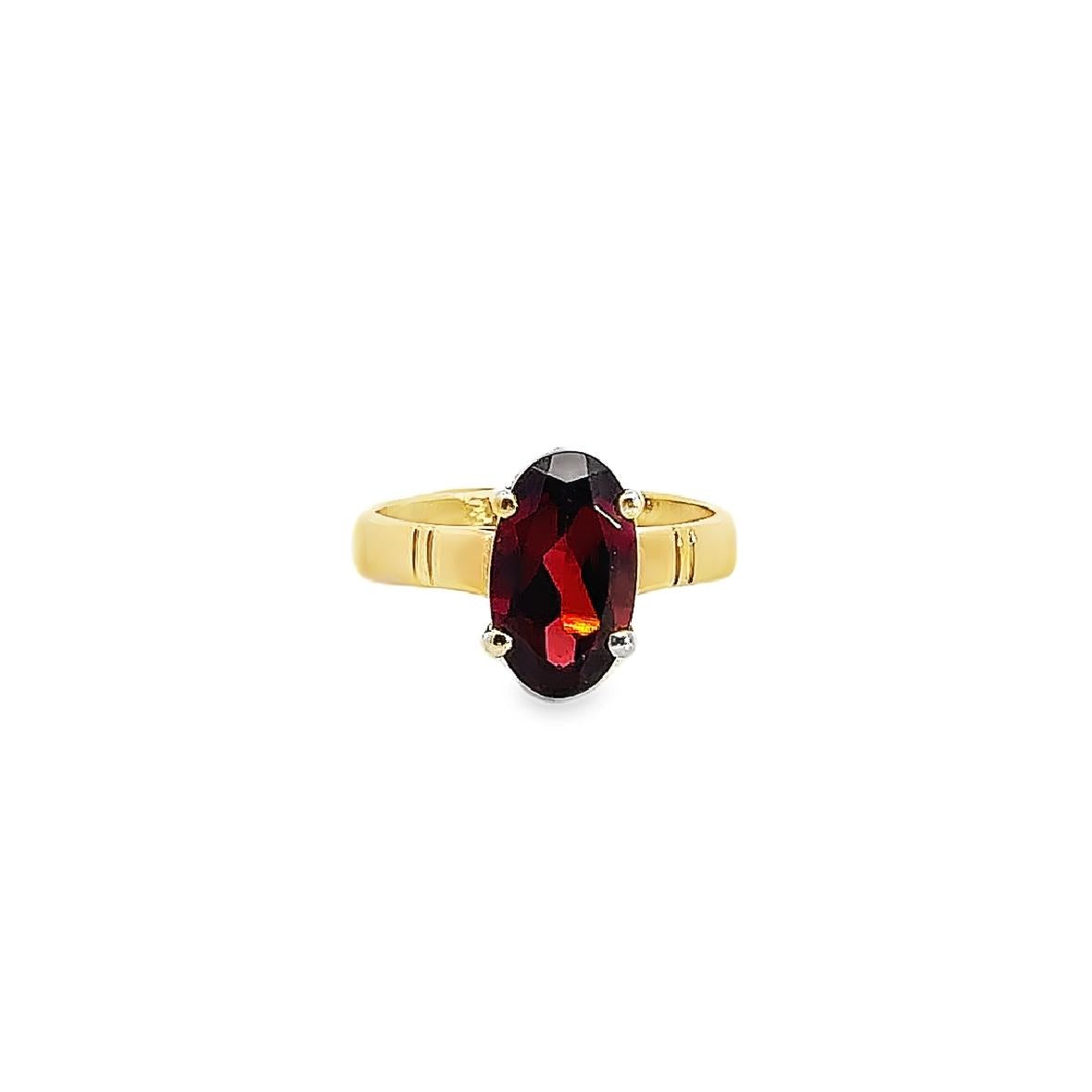 9ct yellow gold ring featuring a 12x7mm oval-cut garnet in a four-claw setting on a polished yellow gold band.