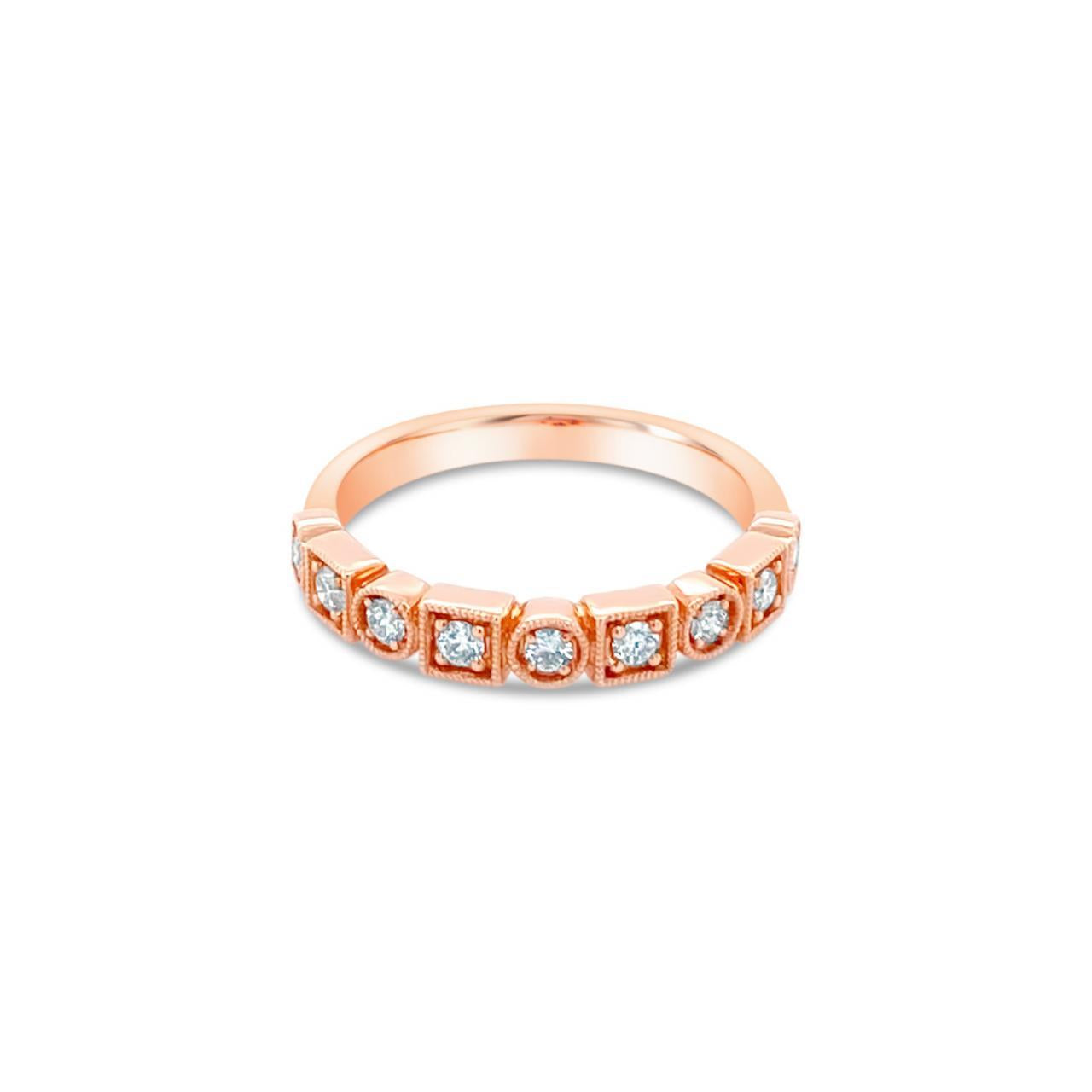 18ct rose gold diamond ring featuring nine round brilliant cut diamonds totalling 0.23ct in alternating round and square-shaped settings across the top.