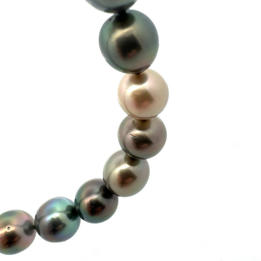 Strand of forty-one graduated Tahitian pearls ranging from 8.60mm to 10.85mm, dark silver to deep purple-green tones, finished with an 18ct yellow and white gold diamond-set clasp.