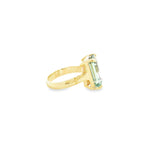 9ct yellow gold ring featuring a 14 x 10mm emerald cut green quartz in a four-claw setting with engraved shoulders.