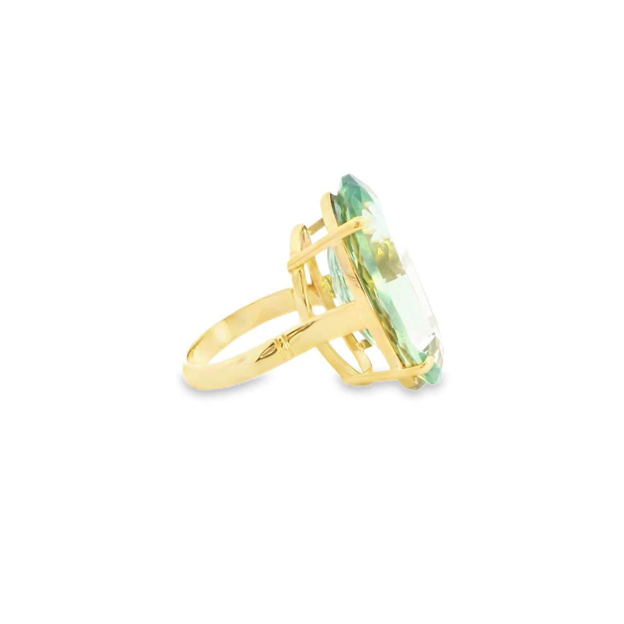 9ct yellow gold ring featuring a large 29 x 18mm oval cut green quartz in a four-claw setting with engraved shoulders.