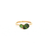 9ct yellow gold “Toi et Moi” ring featuring a 1.22ct pear cut and 0.32ct round green sapphire in angled claw settings with post and bezel collets.