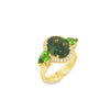18ct yellow gold ring featuring oval green sapphire, tsavorite garnets, and diamond halo design with intricate undercarriage detail.