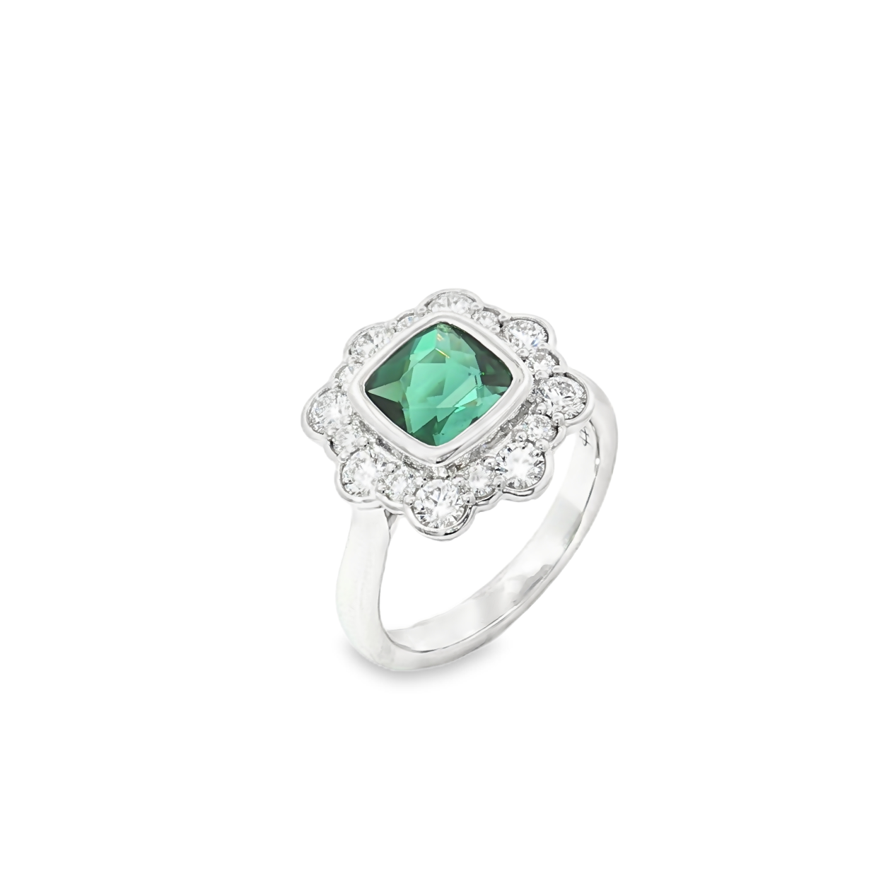 18ct white gold ring featuring a 1.61ct cushion cut green tourmaline with alternating claw and semi-bezel set diamond surround.