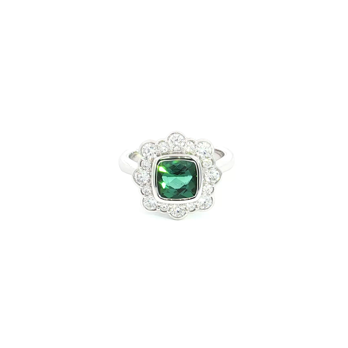 18ct white gold ring featuring a 1.61ct cushion cut green tourmaline with alternating claw and semi-bezel set diamond surround.