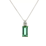 18ct white gold pendant featuring a 4.24ct rectangular cut green tourmaline and bezel-set shield diamond on a fine trace link chain.