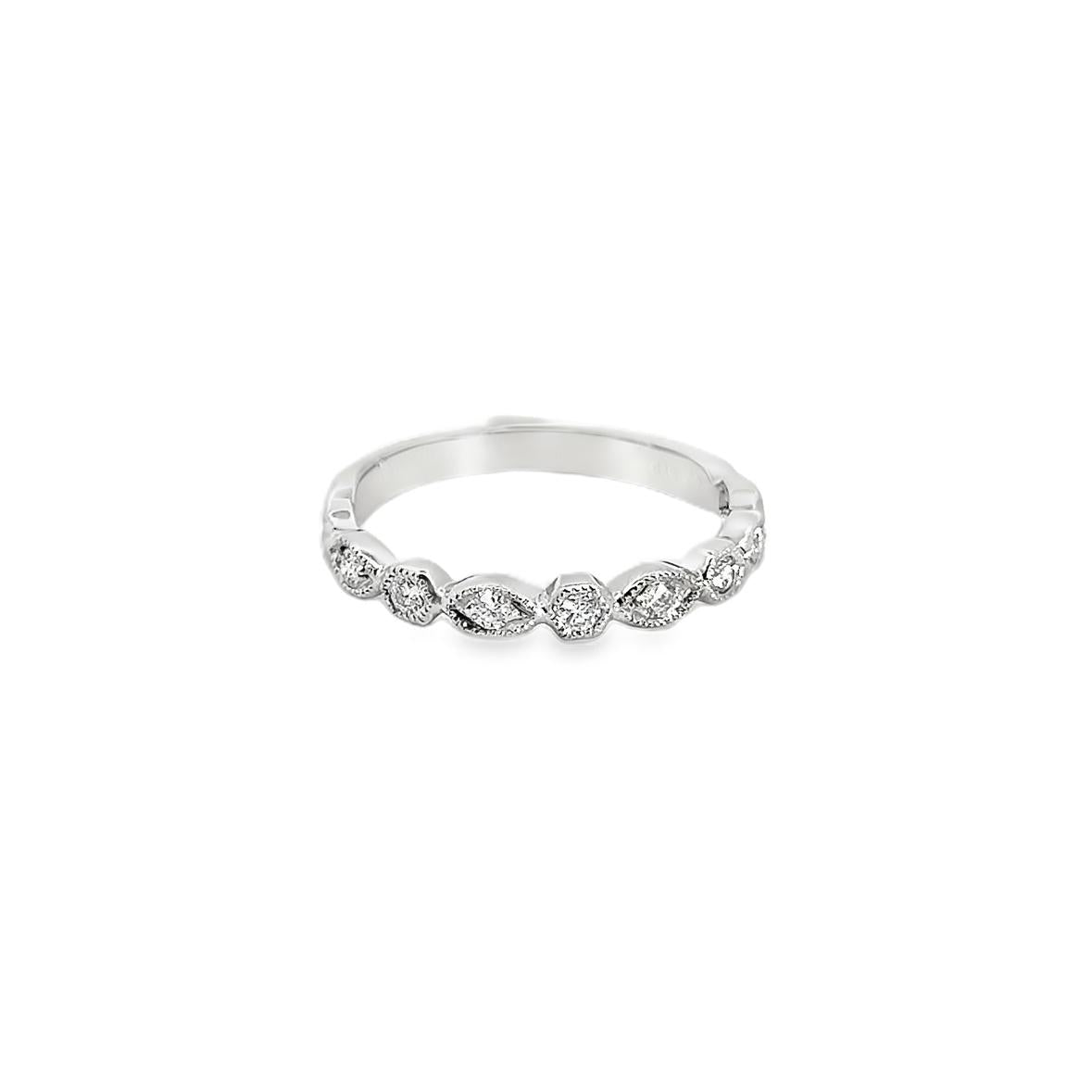 9ct white gold diamond ring featuring nine round brilliant cut diamonds in alternating hexagonal and marquise bead settings across the top.