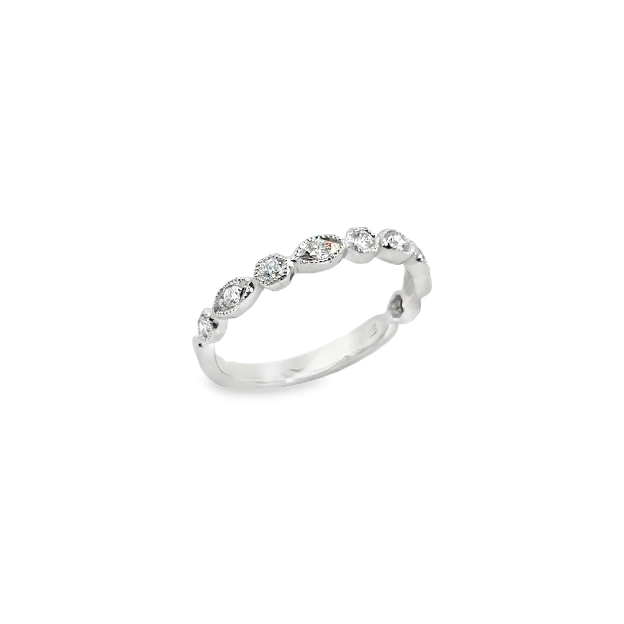 9ct white gold diamond ring featuring nine round brilliant cut diamonds in alternating hexagonal and marquise bead settings across the top.