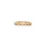 9ct yellow gold diamond ring featuring nine round brilliant cut diamonds totalling 0.20ct in alternating hexagonal and marquise bead settings.