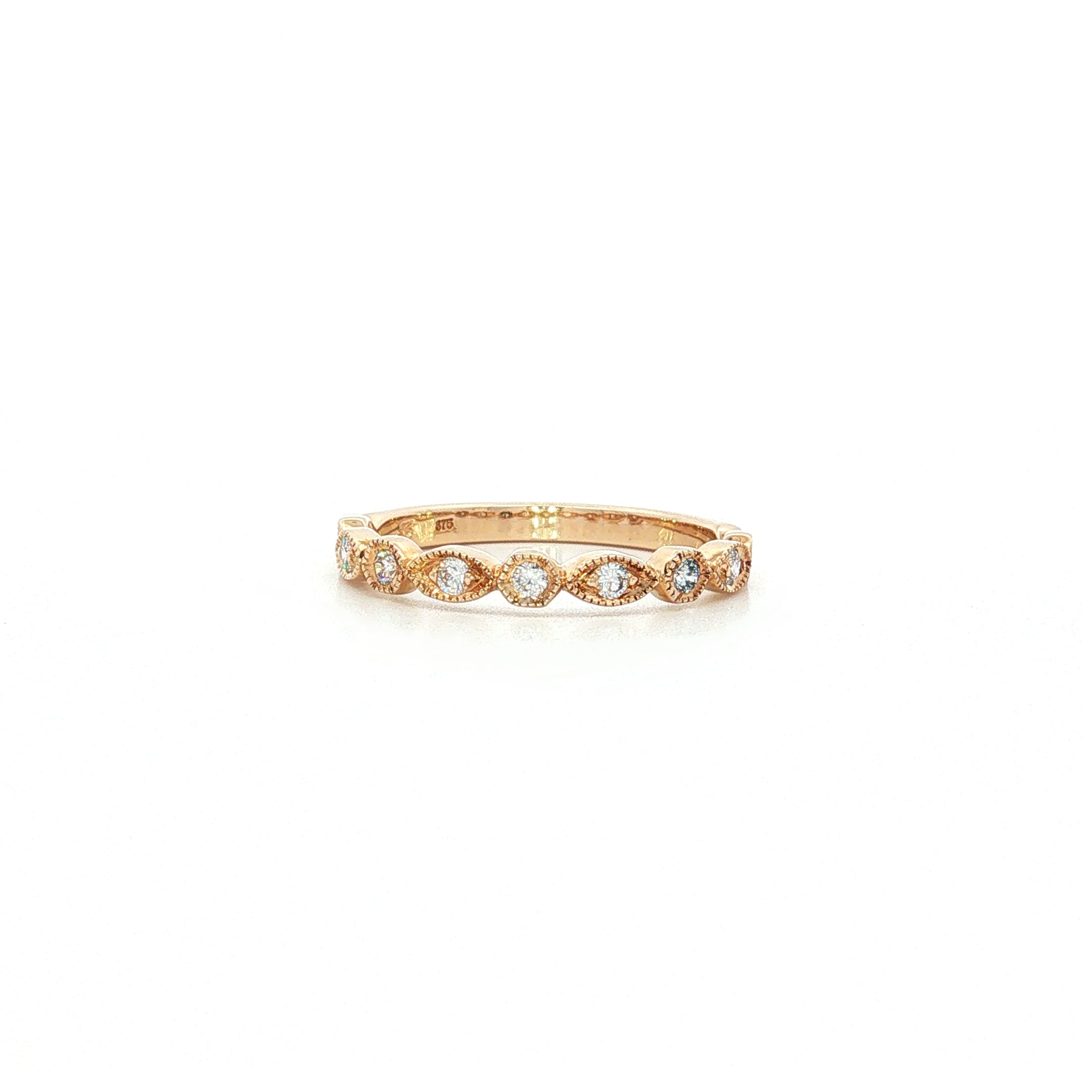 9ct yellow gold diamond ring featuring nine round brilliant cut diamonds totalling 0.20ct in alternating hexagonal and marquise bead settings.