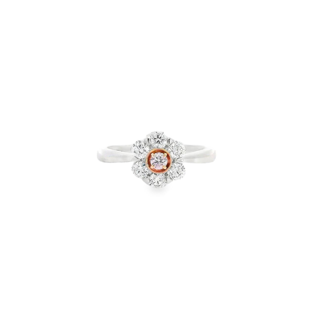 18ct white and rose gold Kimberley Peony ring featuring a natural Argyle pink diamond and white diamond posy cluster design with tapered shoulders.