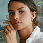 Roberto Coin Love In Verona 18ct yellow gold diamond huggie earrings featuring flower motif and hidden rubies.