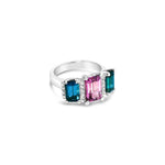 18ct white gold ring featuring a 2.11ct emerald cut purple-pink Malaia garnet with two greenish-blue tourmalines and diamond-set tiered claw and bar details.