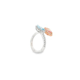 18ct white and rose gold ring featuring a cross-over design with pear-cut morganite and aquamarine gemstones surrounded by diamond halos and claw-set diamond shoulders.