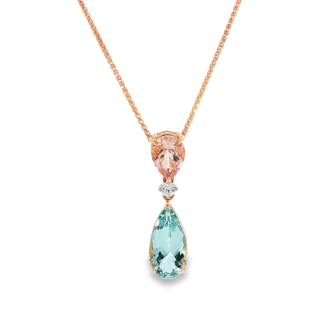 18ct rose and white gold pendant featuring pear-cut morganite and aquamarine with a central diamond accent and concealed pendant runner.