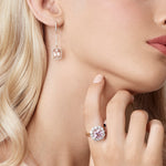 18ct rose gold morganite and diamond drop earrings featuring cushion cut morganites with diamond halos and continental clasps.