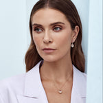 18ct rose gold pendant featuring a 3.09ct oval-cut morganite with an oval diamond halo surround and diamond-set pendant runner for a refined, romantic finish.