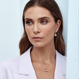 18ct rose gold pendant featuring a 3.09ct oval-cut morganite with an oval diamond halo surround and diamond-set pendant runner for a refined, romantic finish.