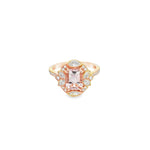 18ct rose gold ring featuring a 1.21ct emerald-cut morganite with marquise and round diamond accents and bead-set diamond shoulders.