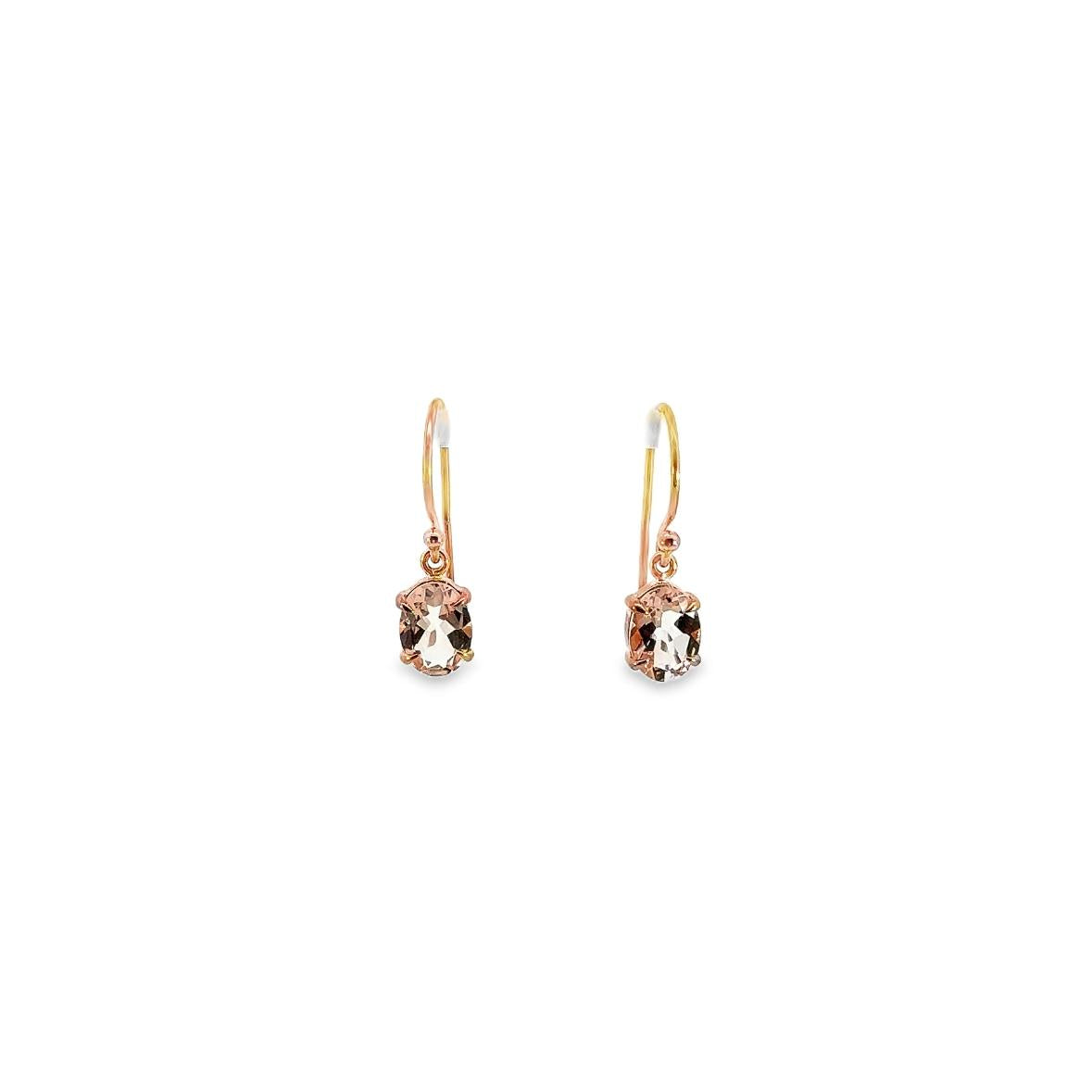 9ct rose gold drop earrings featuring 8x6mm oval-cut morganites in four-claw settings with bezel collets and hook fittings.