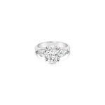 18ct white gold three stone diamond ring featuring a 2.17ct oval centre diamond with pear cut diamond side stones in tiered cap-and-claw settings.