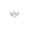 18ct white gold three stone diamond ring featuring a 2.17ct oval centre diamond with pear cut diamond side stones in tiered cap-and-claw settings.