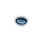 18ct white gold ring featuring a 5.83ct oval cabochon cut London blue topaz in a horizontal bezel setting with a halo of round brilliant cut diamonds.
