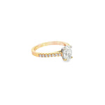 18ct rose and white gold diamond ring featuring a 1.02ct E/SI2 oval cut diamond in a white gold four-claw setting with diamond-set shoulders.